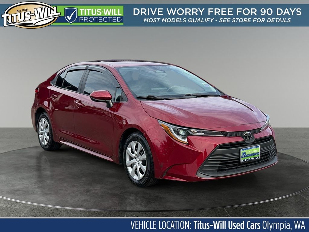 2023 Toyota Corolla LE in Pearl — front three-quarter view