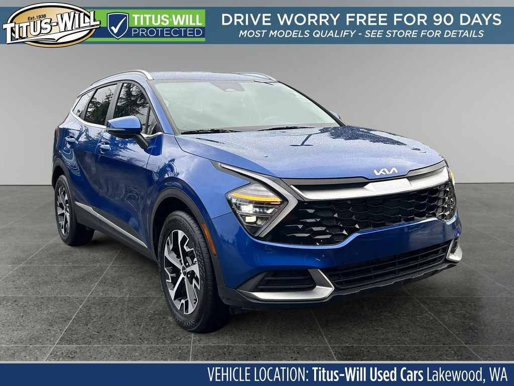 2025 Kia Sportage EX in Sapphire Blue — front three-quarter view