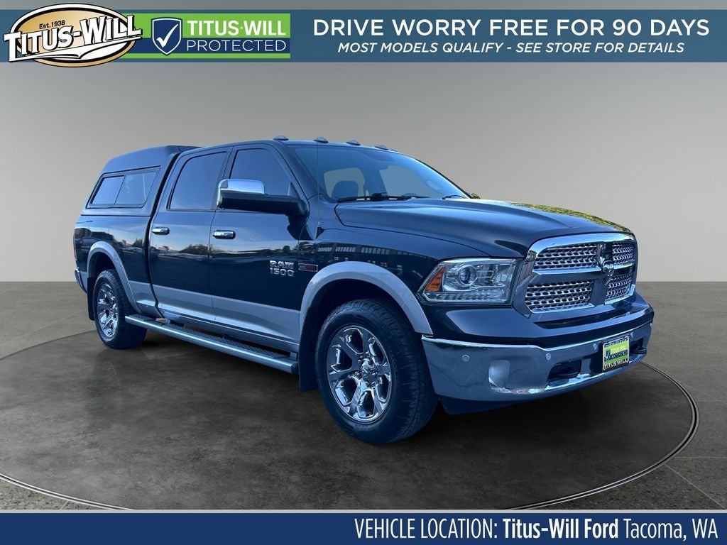 2015 RAM 1500 Laramie in Steel Metallic — front three-quarter view