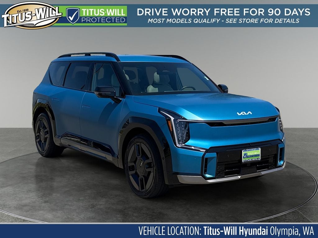 2024 Kia EV9 GT-Line in Ocean Blue Matte — front three-quarter view