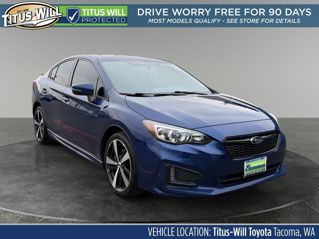 2017 Subaru Impreza 2.0i Sport in Lapis Blue Pearl — front three-quarter view