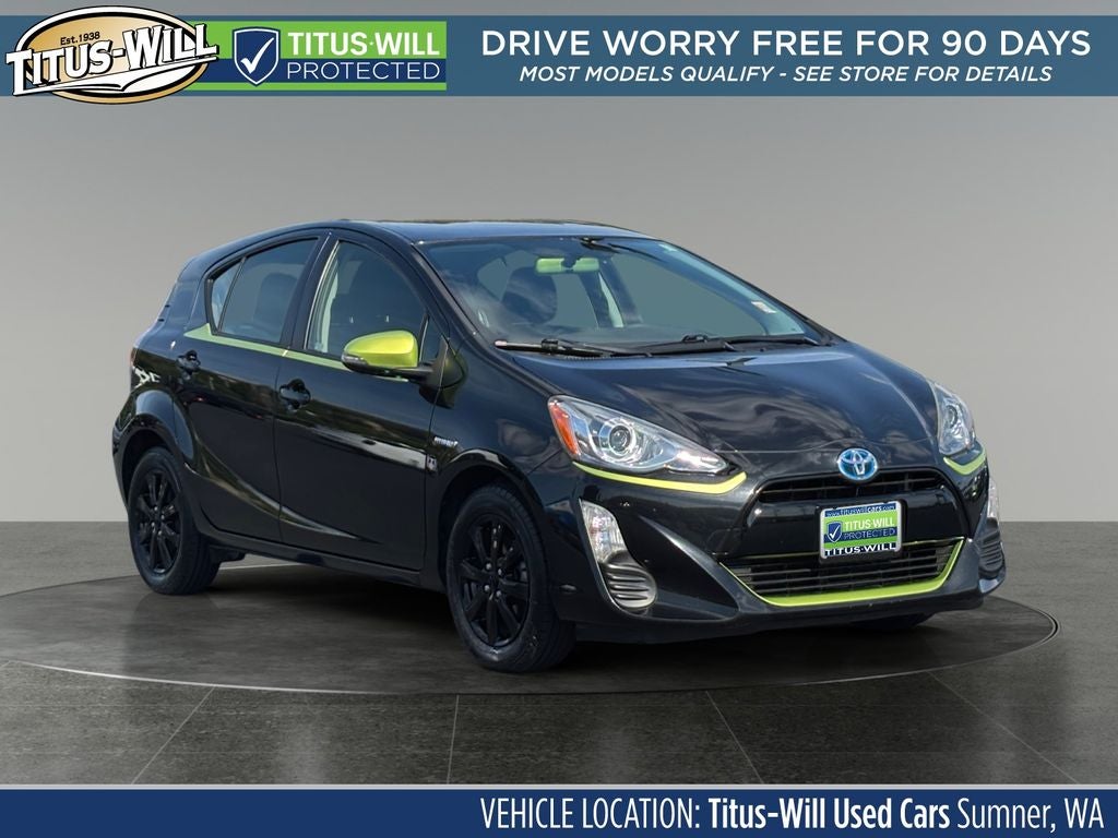 2016 Toyota Prius c Persona Series in Black Sand Pearl — front three-quarter view